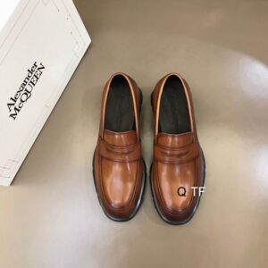 Alexander McQueen Brown Leather Penny Loafers with penny slot detail and robust rubber sole.