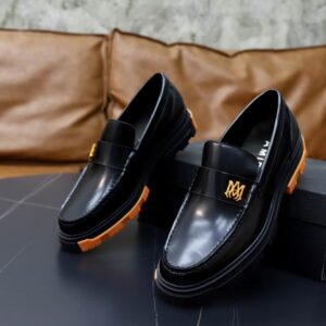 A pair of men's Amiri Black and Orange Mesh Platform Loafers Shoes with orange mesh panels and a chunky platform sole.