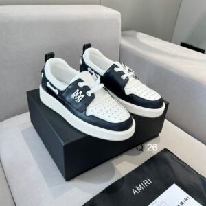 A pair of men's Amiri Black and White Leather Loafers Shoes with star-perforated toes and a thick white rubber sole.