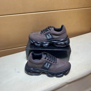 A pair of Armani Exchange Brown Black Chunky Sneakers featuring a matte brown upper, black oversized soles, and side A|X branding.