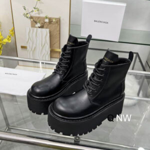 Side view of Balenciaga Black Platform Boots showing the thick lugged sole and lace-up leather upper.