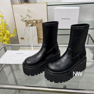 Balenciaga Black Platform Sock Boots with a thick lugged sole and a smooth leather and stretch fabric upper.