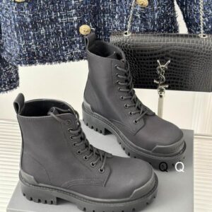Side profile of Balenciaga Grey Strike Boots in matte grey leather featuring a thick platform lug sole and tonal laces.