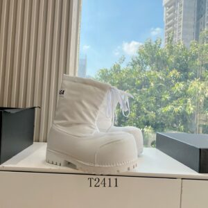 Balenciaga White Alaska Puffy Boot featuring a massive rounded toe, white laces, and a chunky lug sole.
