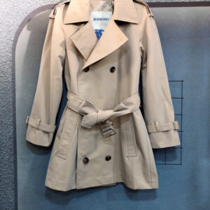 Short women's double-breasted trench coat in Archive Beige with belted waist and check lining. Tailored Chelsea-style jacket.
