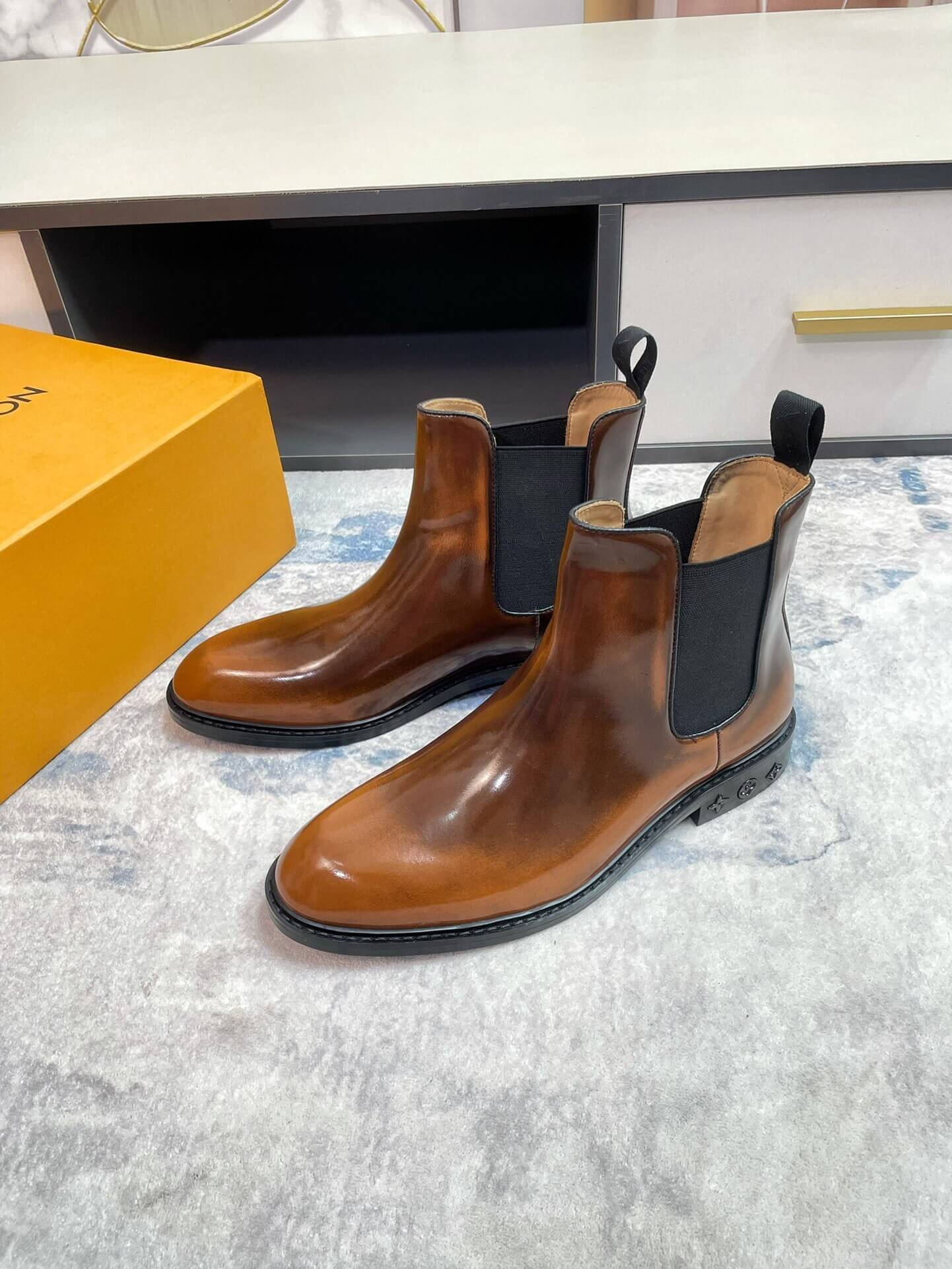 Pair of Classic Patina Chelsea Boots in deep Brown Patina Calfskin Leather with high-gloss finish.