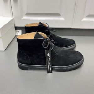 A pair of Emporio Armani Black Suede Chukka Boots featuring a matte black finish, soft foam insole tag, and matching rubber soles.