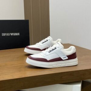 A pair of Emporio Armani White Burgundy Low-Top Sneakers featuring white leather uppers and deep burgundy trim.