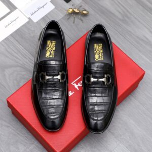 Men's Ferragamo Black Gancini Embossed Loafers featuring a silver buckle and crocodile texture.