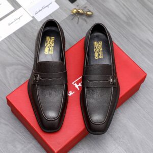 Men's Ferragamo Brown Pebbled Leather Loafers with Gancini accent and penny strap.