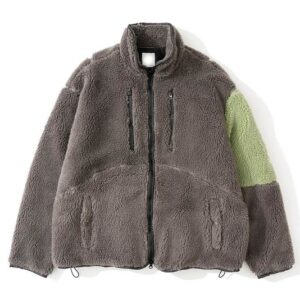 A thick Grey Sherpa Fleece Jacket with a lime green contrast panel on the sleeve and multiple zippered pockets.