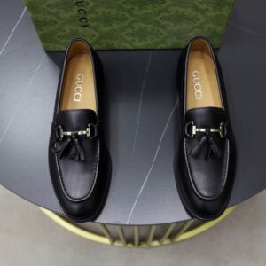 Gucci Black Leather Horsebit Loafers with tassels and antique gold horsebit detail.