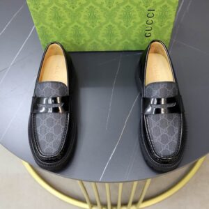 Gucci Grey GG Supreme Leather Loafers with black patent leather accent and signature Gucci detailing.