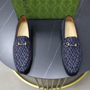 Gucci Navy GG Marmont Leather Loafers with antique gold horsebit detail and signature GG Marmont pattern.