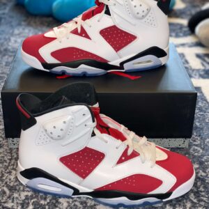 Side view of the Jordan 6 Retro White Carmine Black showing the bold red and white contrast panels.