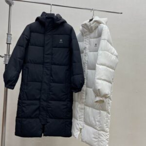 A premium Black Long Puffer Jacket featuring a longline quilted design and a large protective hood.