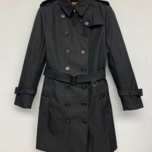 Mid-length double-breasted unisex trench coat in Black with belted waist and classic check lining. Tailored Kensington-style.