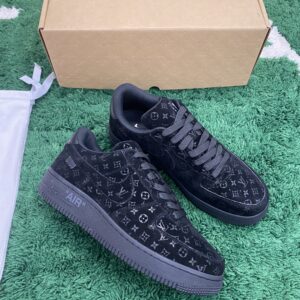 LV X NIKE AIR FORCE 1 Low Monogram Velvet Black sneakers, displayed on a green carpet with a brown box, showcasing the full black velvet Monogram texture and rear heel branding.