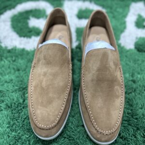 Loro Piana Style plain camel suede slip-on moccasins with a light cream rubber sole, showcasing the hand-stitched apron toe.