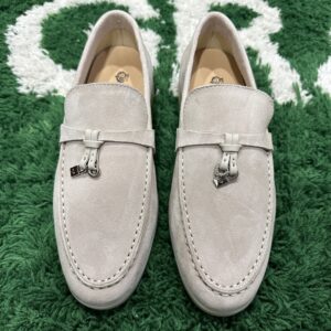 Luxury beige suede Loro Piana Summer Walk loafers with white rubber soles on a neutral background.