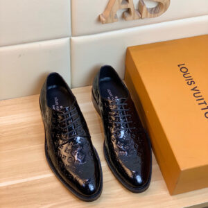 Close-up of Louis Vuitton Black Monogram Derby Shoes featuring embossed logo pattern and patent finish.