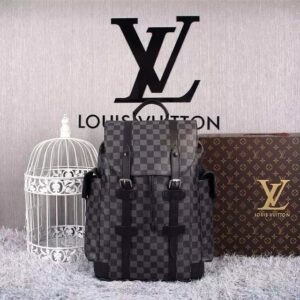 Front view of the Louis Vuitton Black Monogram Palm Springs Backpack featuring black monogram canvas and gold zippers.