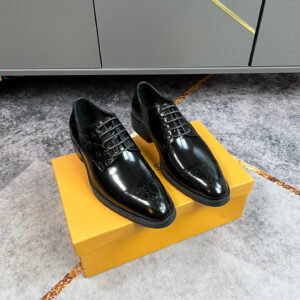 A pair of Louis Vuitton Black Monogram Pattern Derby shoes featuring high-gloss leather and embossed monogram side panels.