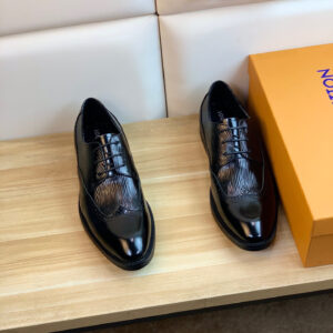 Front view of Louis Vuitton Black Oxford Shoes featuring textured leather and brogue wingtip details