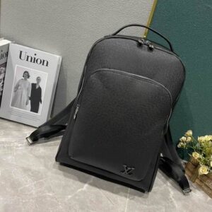 Front view of the Louis Vuitton Black Taiga Leather Discovery Backpack in textured black leather with silver zippers and a front pocket.
