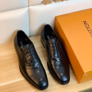 A close-up view of the Louis Vuitton Brogue Detail Black Oxford showing the delicate perforated stitching and smooth black leather finish.