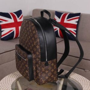 Front view of the Louis Vuitton Brown Monogram Josh Backpack with signature canvas and black leather trim.