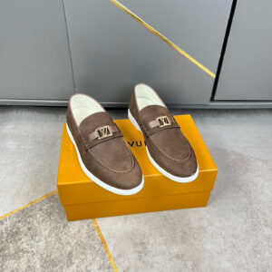 Louis Vuitton Brown Suede Casual Loafers displayed with soft suede upper, slip on design, metallic emblem detail, and white comfort sole