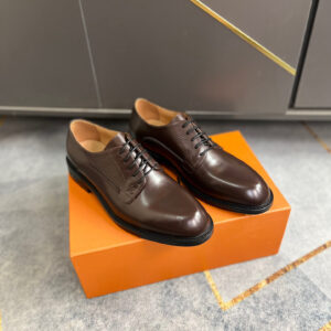 Side view of Louis Vuitton Brown Vendôme Derbies featuring ribbed leather textures and Monogram flower heels.