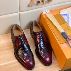 A pair of Louis Vuitton Burgundy Croc Brogue Oxford Shoes with wingtip detailing and a high-shine embossed finish.