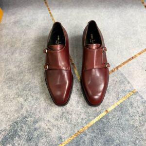 Pair of burgundy Louis Vuitton double monk-strap loafers with silver buckles.