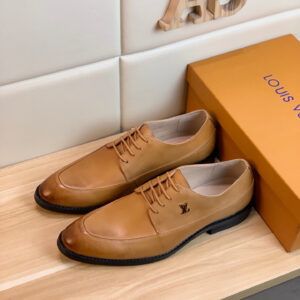 Louis Vuitton Damier Ebene Cap Toe Derby Shoes featuring brown checkered canvas and a high-shine black patent toe on an orange display box.