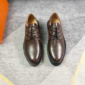 Top-down view of black Louis Vuitton Oxford shoes featuring Damier Graphite canvas panels and a thick rubber lug sole.