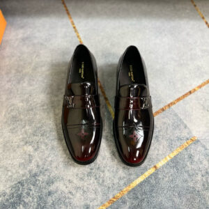 Pair of high-shine burgundy and black gradient Louis Vuitton loafers with silver LV logo and embossed toe detail.