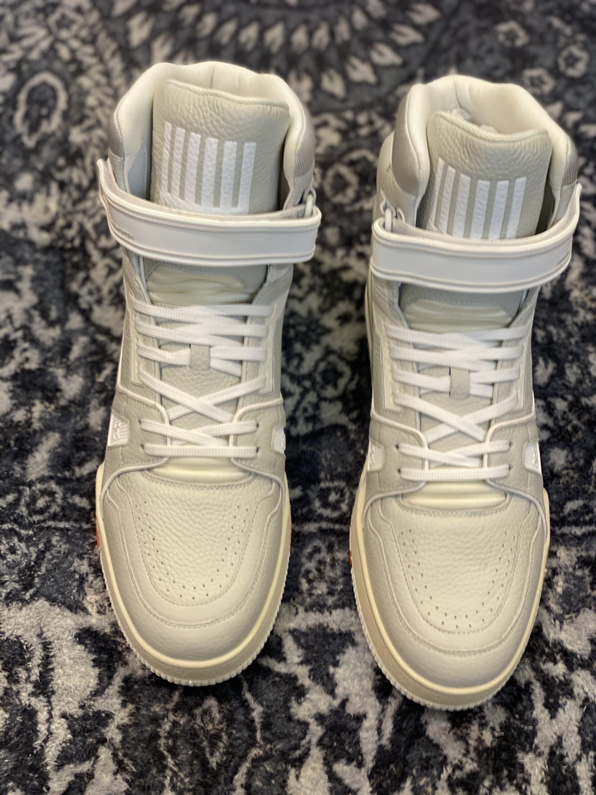 Top view of the Louis Vuitton LV Trainer High in beige leather, showing the "408" logo and white ankle strap.