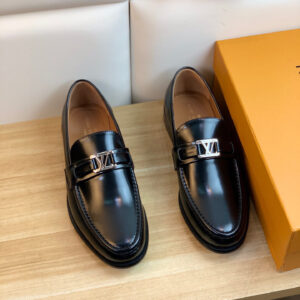 Close-up of Louis Vuitton Major Loafers in Black Glazed Calf Leather featuring the silver LV Initials hardware.