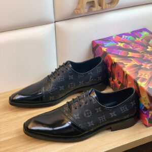 Louis Vuitton Monogram Eclipse Cap Toe Shoes featuring black monogram canvas and a high-shine patent leather toe on a colorful display box.