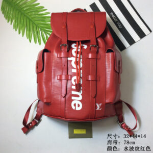 A Louis Vuitton Red Epi Christopher Backpack featuring white Supreme branding and silver buckle details.