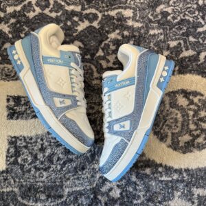Side-by-side view of Louis Vuitton Trainer Light Blue White Swarovski sneakers showing the crystal-encrusted blue overlays.