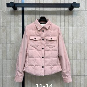 A woman wearing the Moncler White Quilted Corduroy Jacket featuring a button front and quilted back.