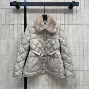 A studio shot and lifestyle view of the Moncler White Belted Diamond Quilted Jacket featuring a plush cream faux fur collar and waist belt.