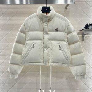 Front and rear view of the Moncler White Cropped Puffer Jacket featuring a stand collar and adjustable waist drawstring.