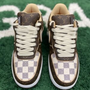 Front view of LV X NIKE AIR FORCE 1 LOW MONOGRAM BROWN DAMIER AZUR sneakers featuring brown monogram leather and checkered Damier Azur accents.