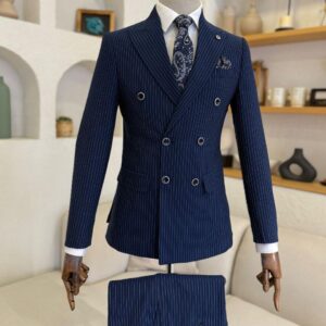 Men's Navy Blue Pinstripe Double Breasted Suit featuring peak lapels and a matching patterned tie on a mannequin.