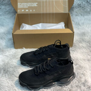 Side view of Nike Black Anthracite Air Max Flyknit Shoes featuring a black knit upper and a chunky translucent Air Max sole.