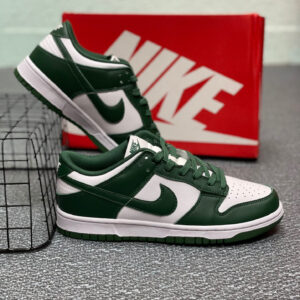 Side view of Nike Gorge Green/White Low Dunks featuring green leather overlays and white panels.